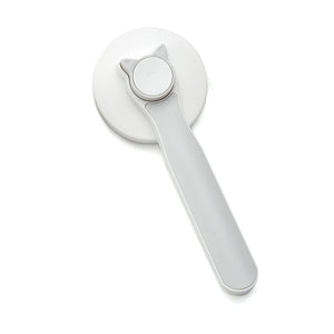 Self-cleaning slicker brush